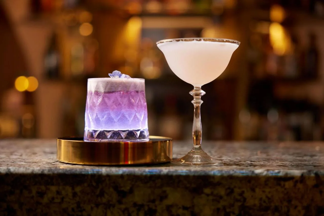A cocktail and a glass on a table at the Sound Bar, The Cumberland